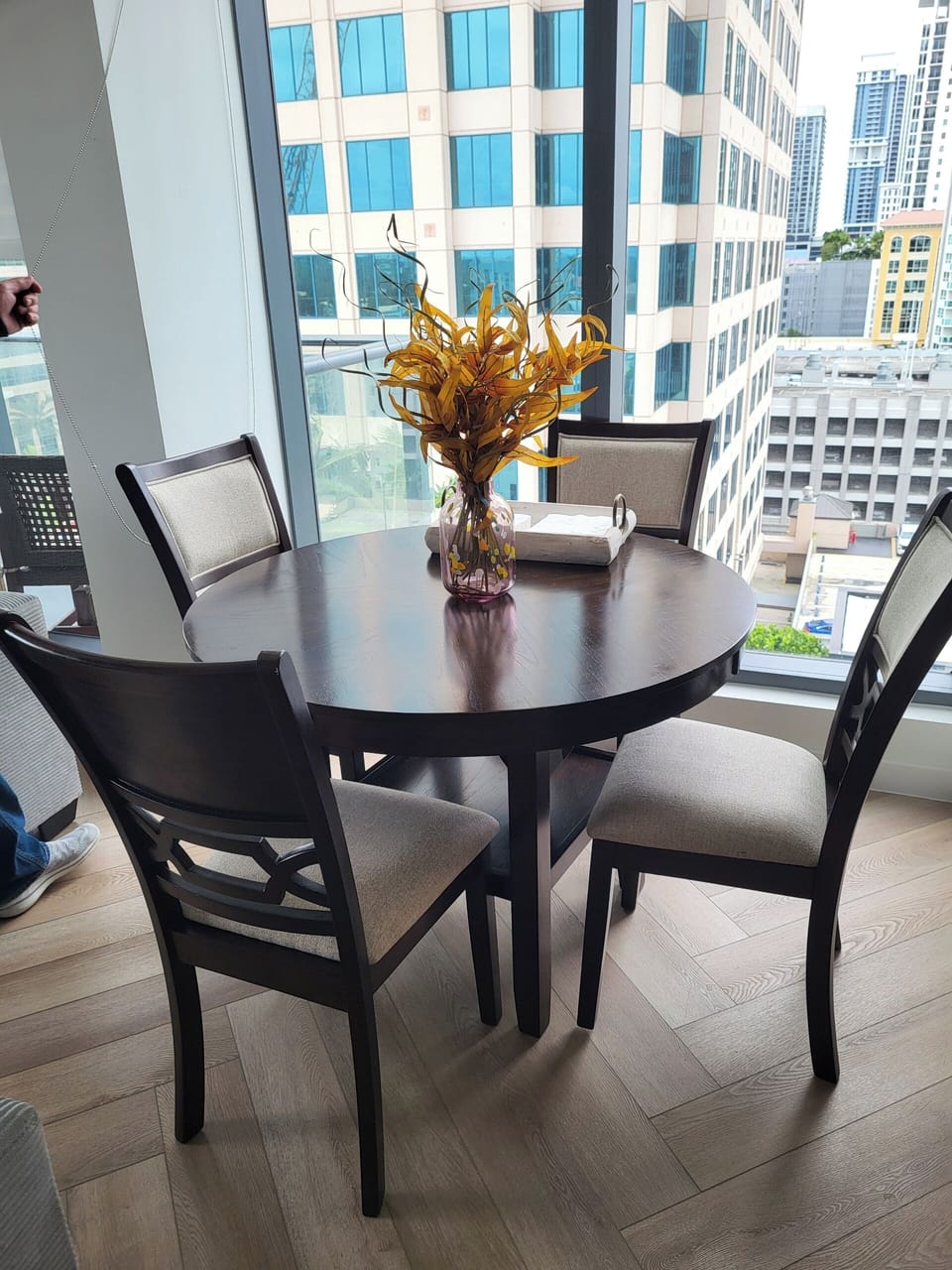 Dining area overlooking pool and city.