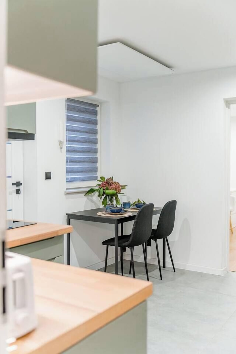 Living Area with Sofa Bed and Dining Table | Book Now with RENTUJEMY.COM