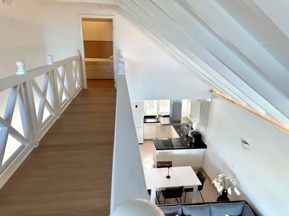 View of the mezzanine passage leading to the third bedroom.