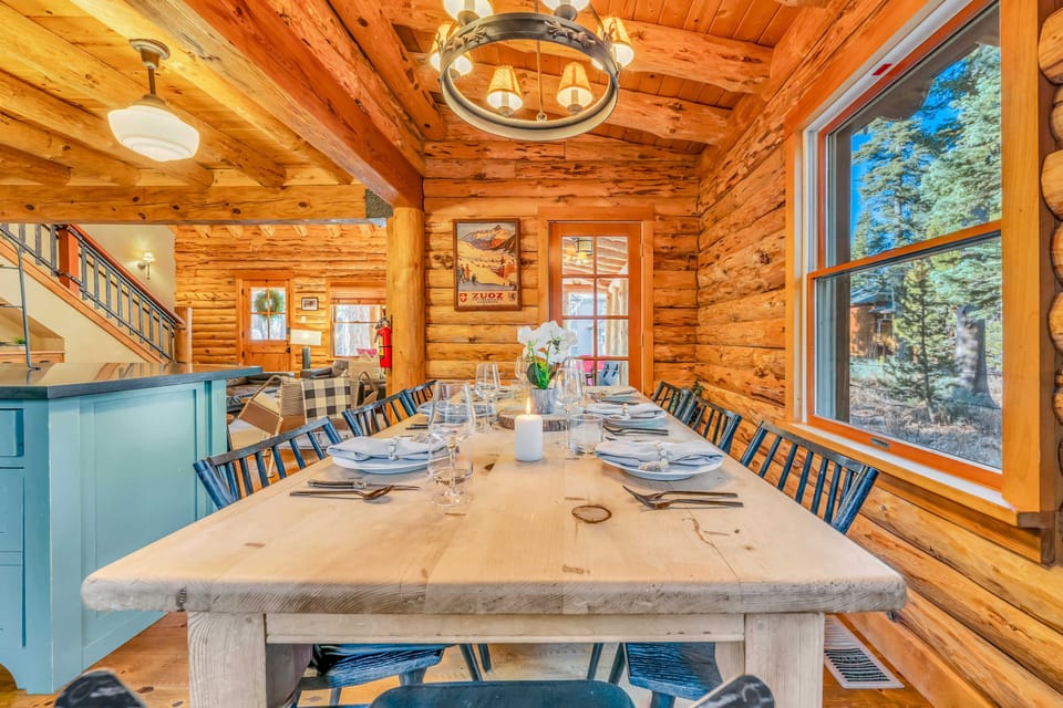 Dining area: 8-person table, forest views, deck access