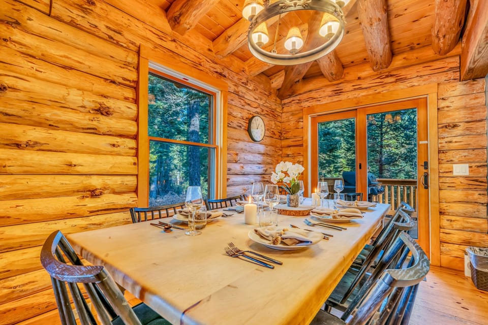 Dining area: 8-person table, forest views, deck access