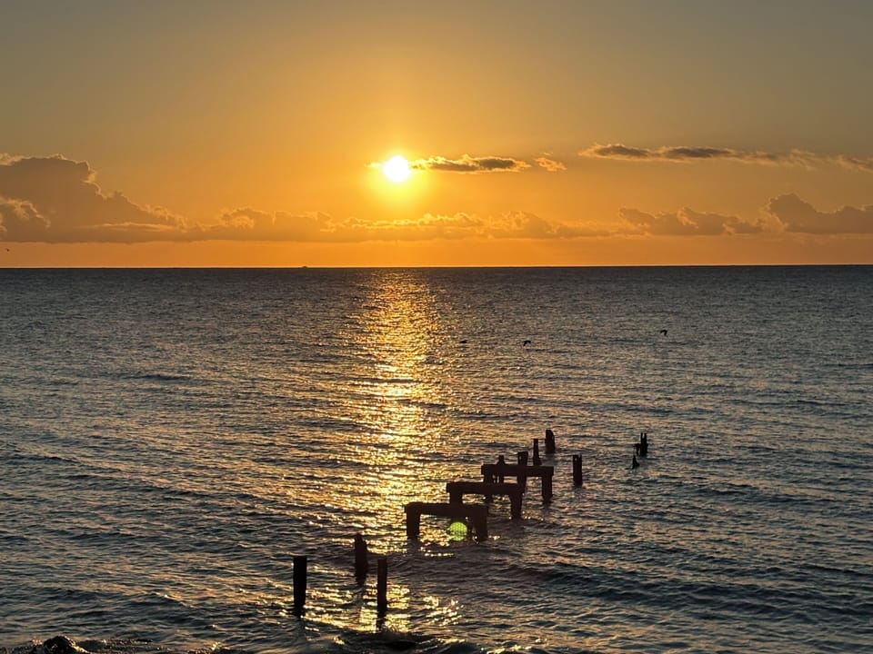 Grab a cup of coffee, walk the 1/4 mile to this beach and watch the sunrise.