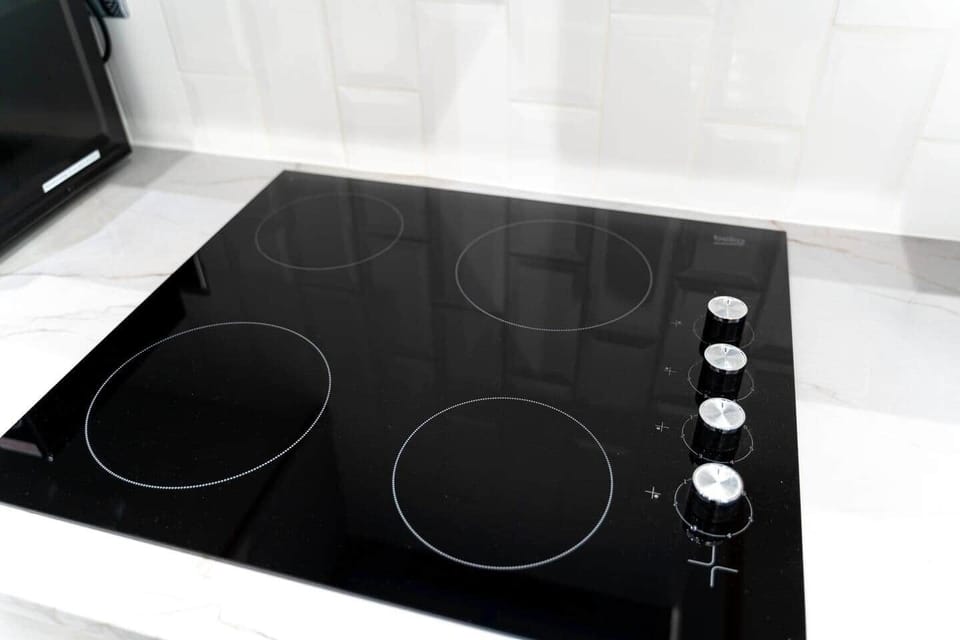 The kitchen has a contemporary and stylish aesthetic that seamlessly integrates with the overall ambiance of the house. Clean lines, minimalist decor, and high-quality materials create an inviting space that is both visually striking and practical.