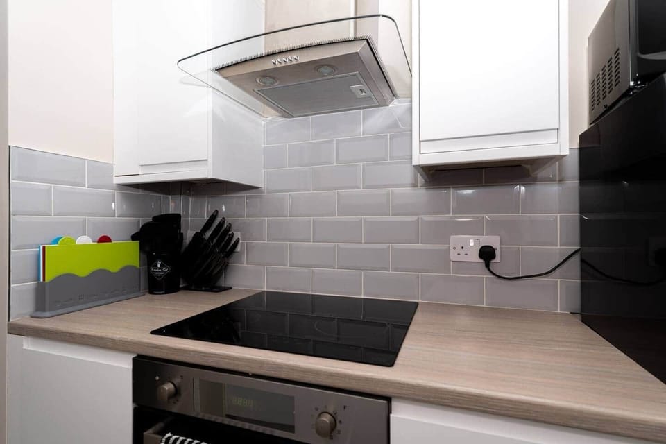 The kitchen has a contemporary and stylish aesthetic that seamlessly integrates with the overall ambience of the house. Clean lines, minimalist decor, and high-quality materials create an inviting space that is both visually striking and practical.