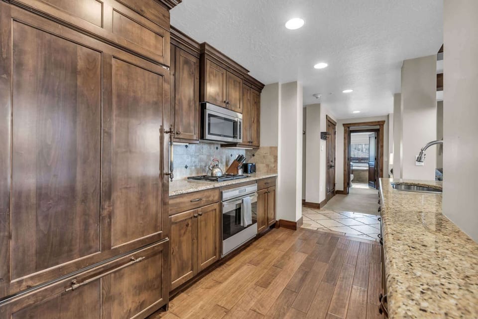 Unit B’s inviting open kitchen offers ample space & all the comforts of home​