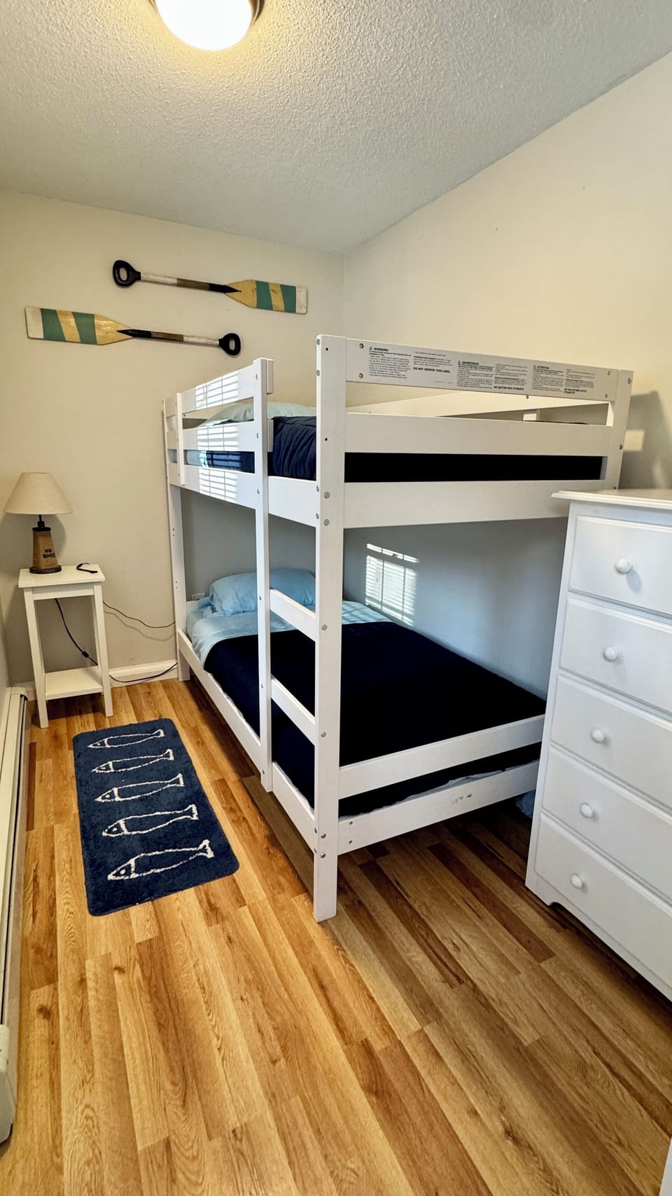 Bunk bed, dresser and a TV.