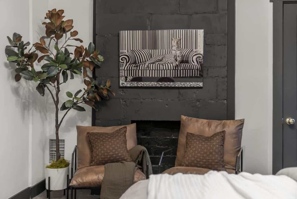 Cozy seating nook w/ textured pillows, warm decor & an inviting spot to unwind ️