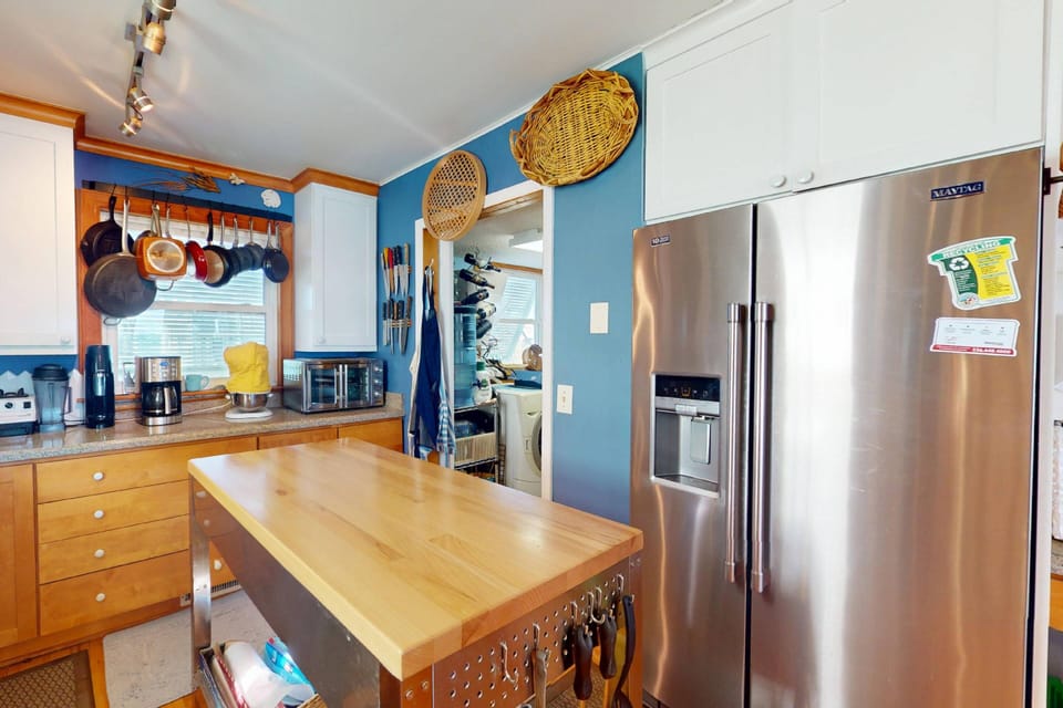 Off the kitchen is the laundry area and a half bathroom