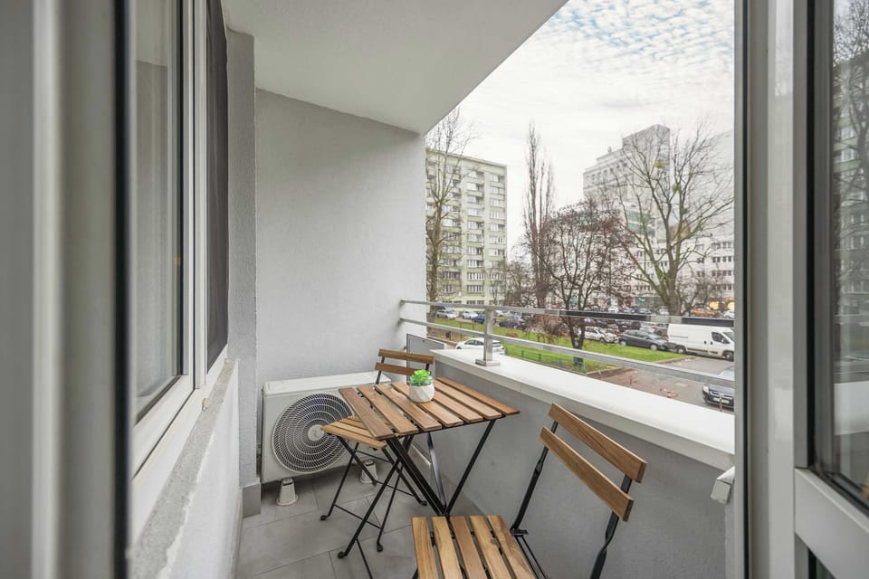 The balcony provides a perfect spot for enjoying the fresh air. 
