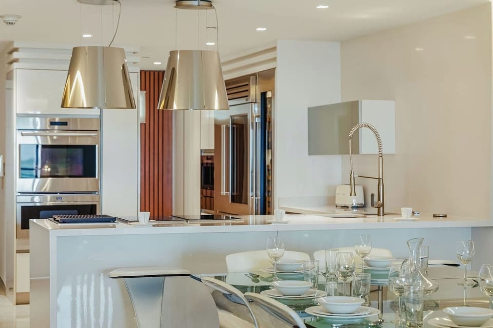 Step into this stylish open kitchen and dining space—perfect for cooking, sharing meals, and lingering over good conversation. It’s a welcoming spot that’s ready to make you feel right at home.