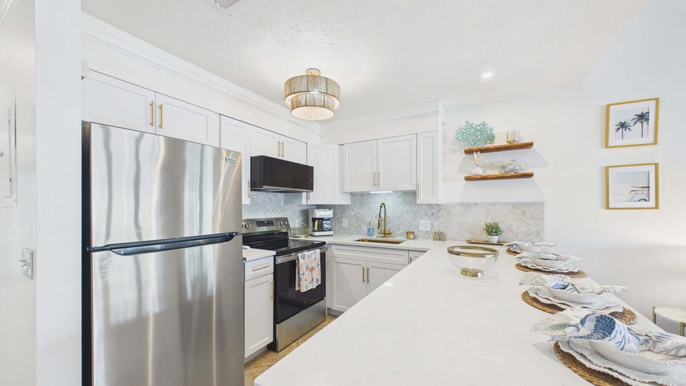 Open kitchen layout fully applianced with all the cooking essentials for your culinary needs