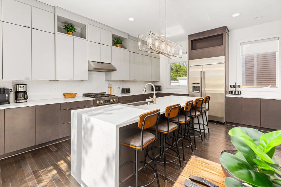  Modern design meets functionality with sleek counters and stylish bar seating!