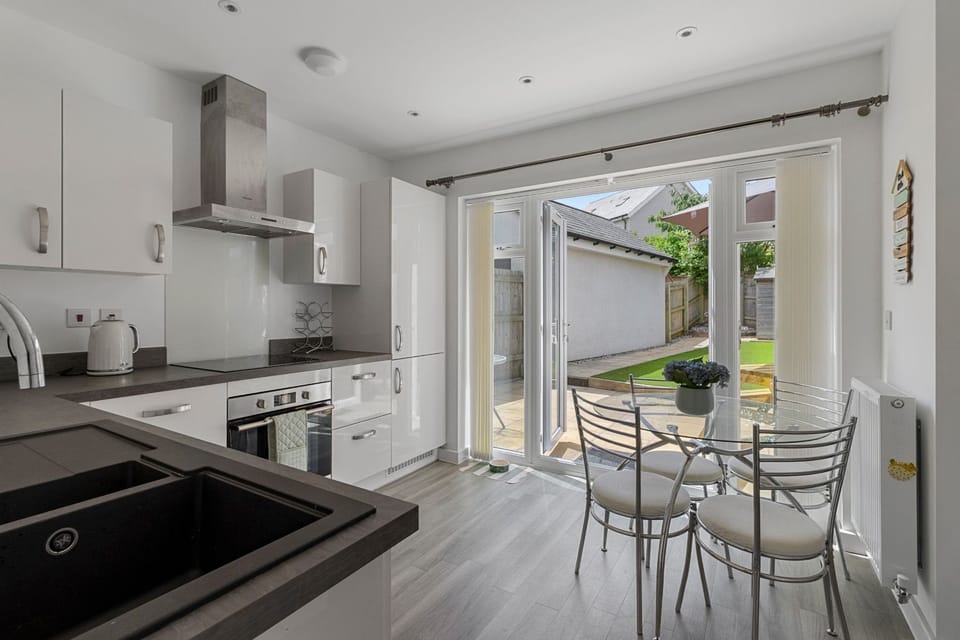 Cook, dine, and unwind with direct access from the sleek kitchen to your own private outdoor space.