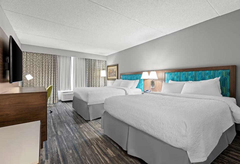 Stretch out on two crisp queen beds for restful sleep.