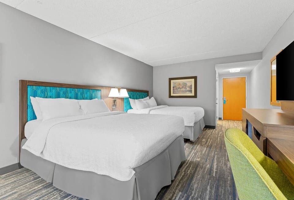 Drift off comfortably with generous floor space around both beds.