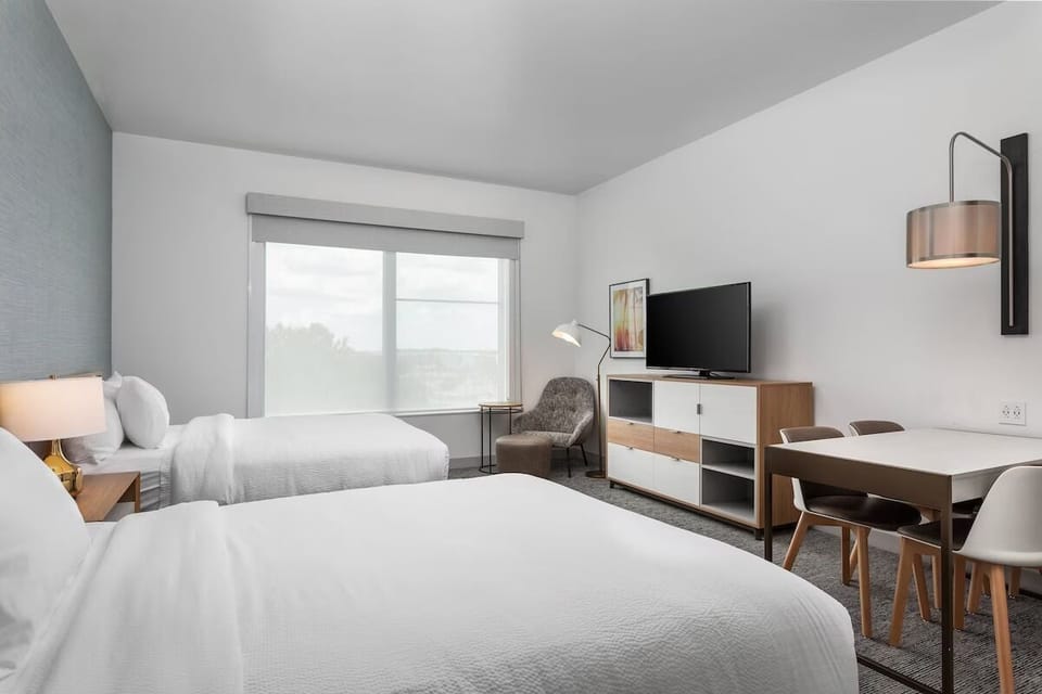 Spread out comfortably with two beds and an in-room dining table.