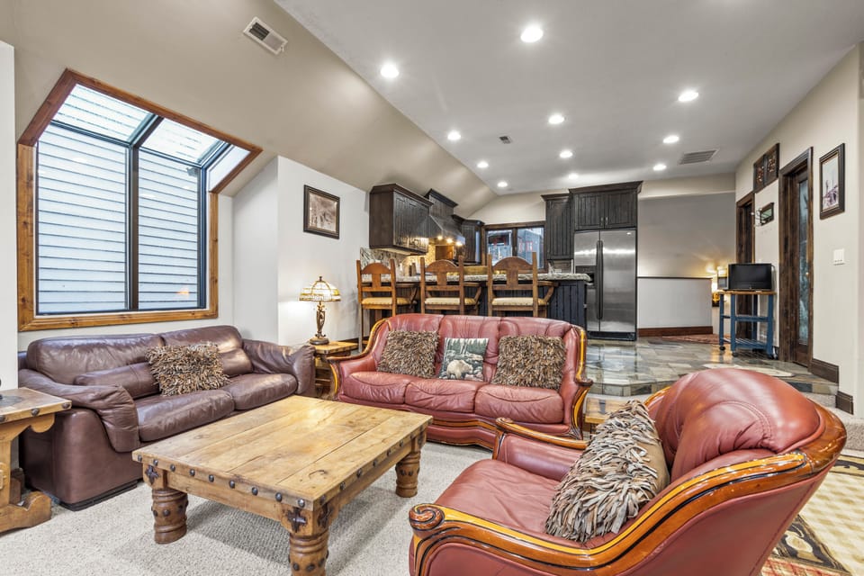 Sink into plush leather seating in your open-concept living space and a gourmet kitchen awaits.