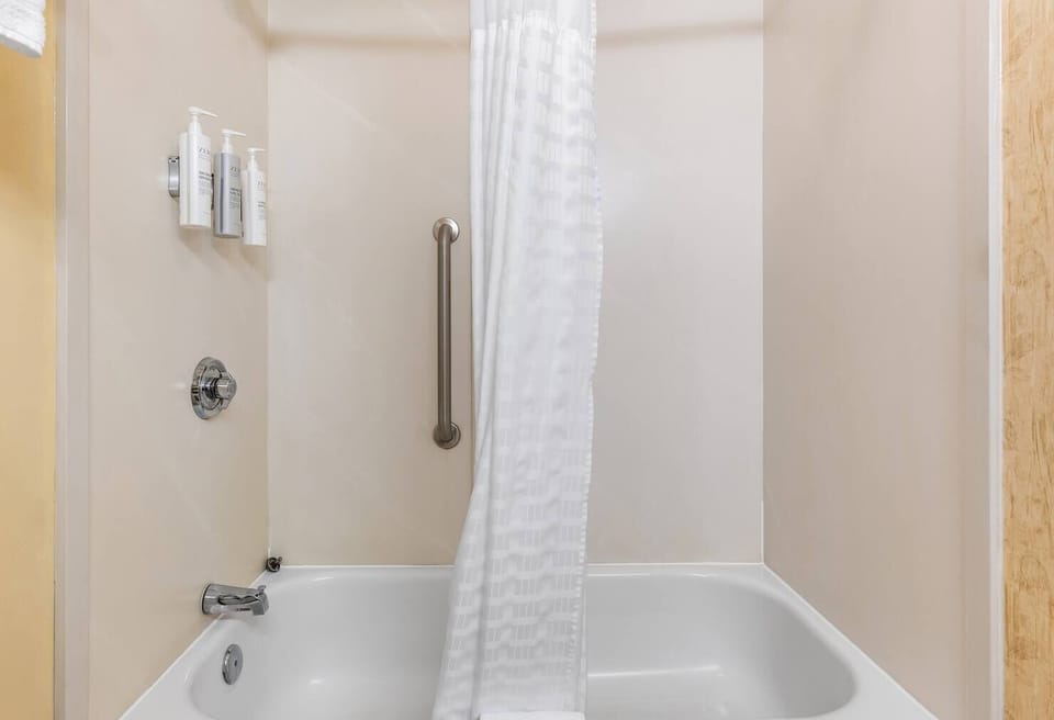 Refresh after a long day in a spotless shower-tub combo.