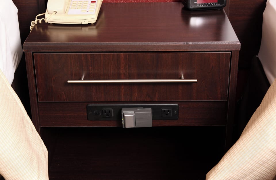 Recharge devices effortlessly with convenient bedside outlets and storage.