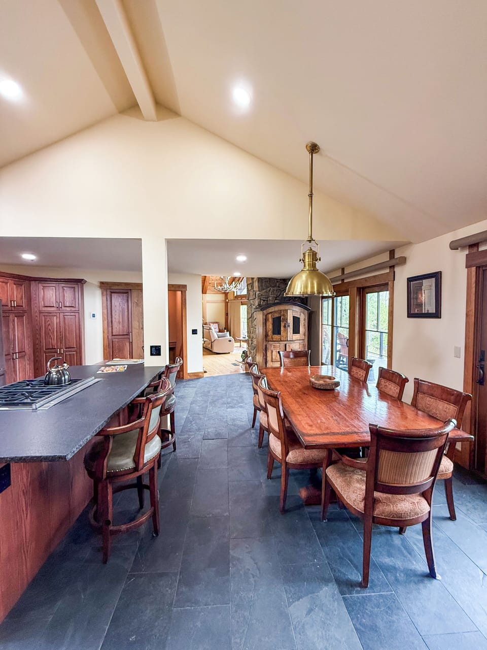 A stunning open-concept kitchen, dining, and living area.