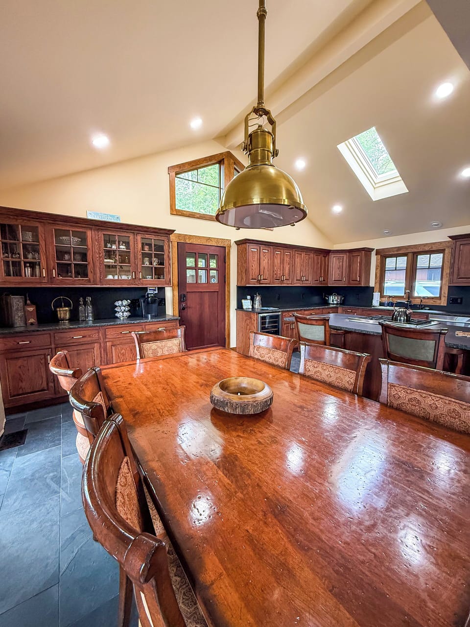 A stunning open-concept kitchen, dining, and living area.