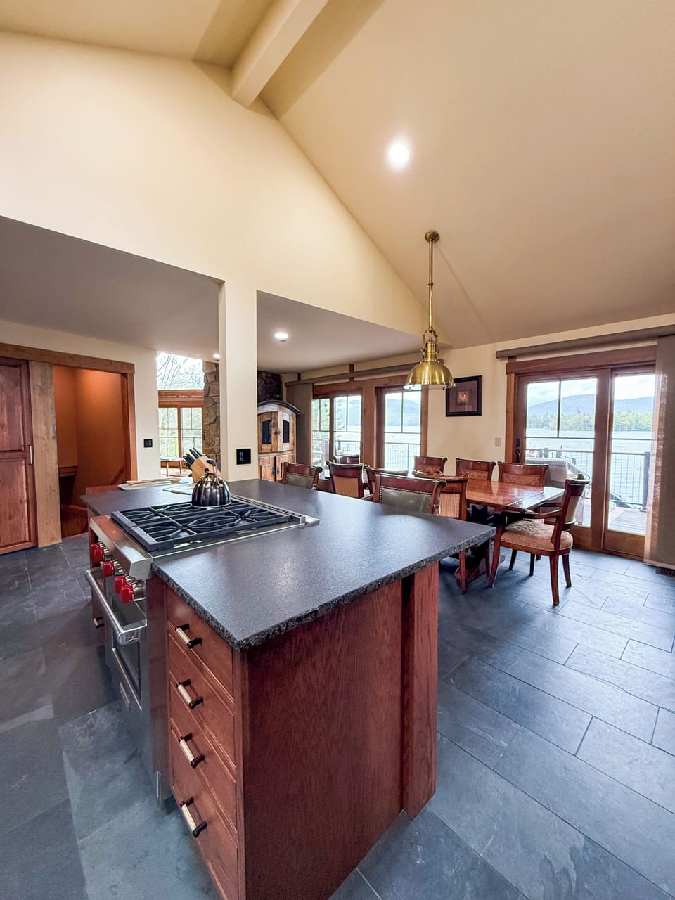 A stunning open-concept kitchen, dining, and living area.