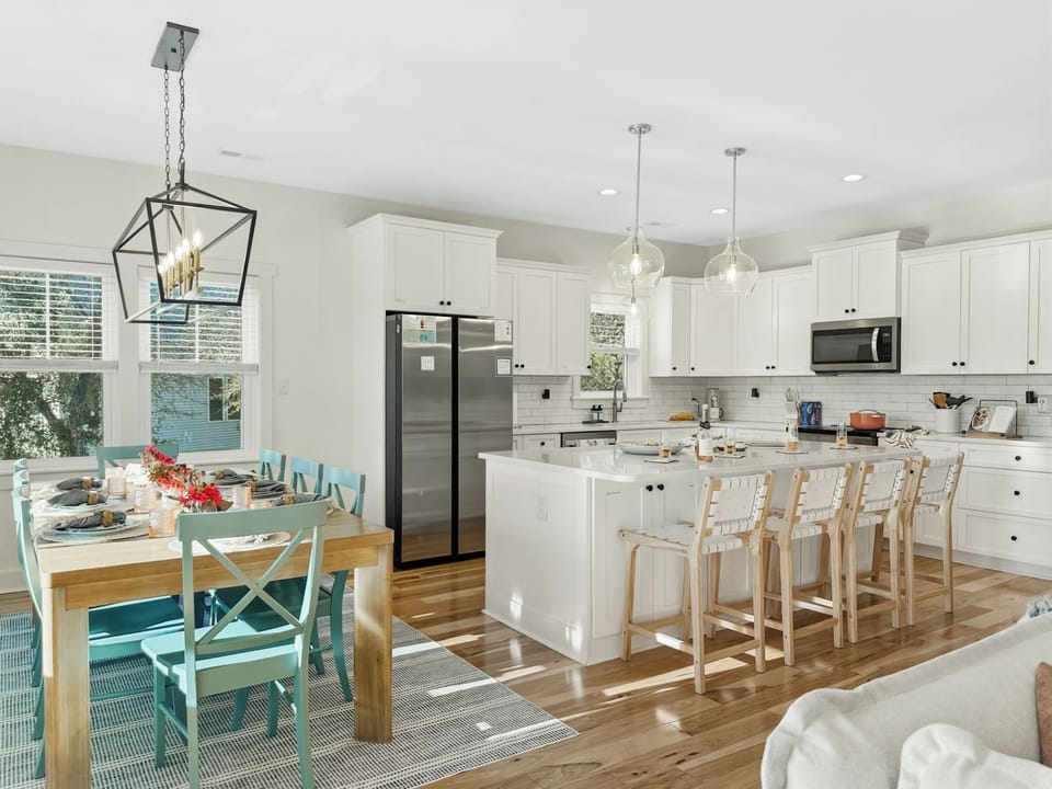 The open kitchen and dining are perfect for socializing while preparing meals.