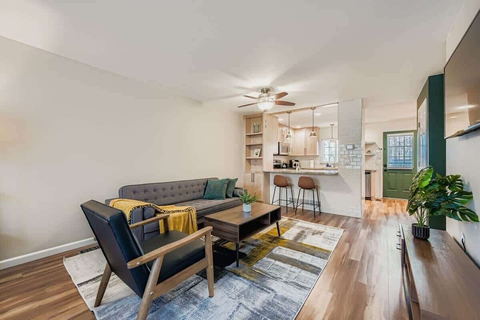 Living room with view into the kitchen through the breakfast bar