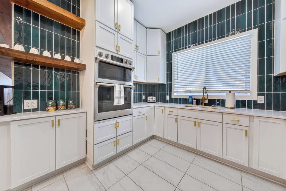 Enjoy morning coffee in a light-filled kitchen designed for effortless living.