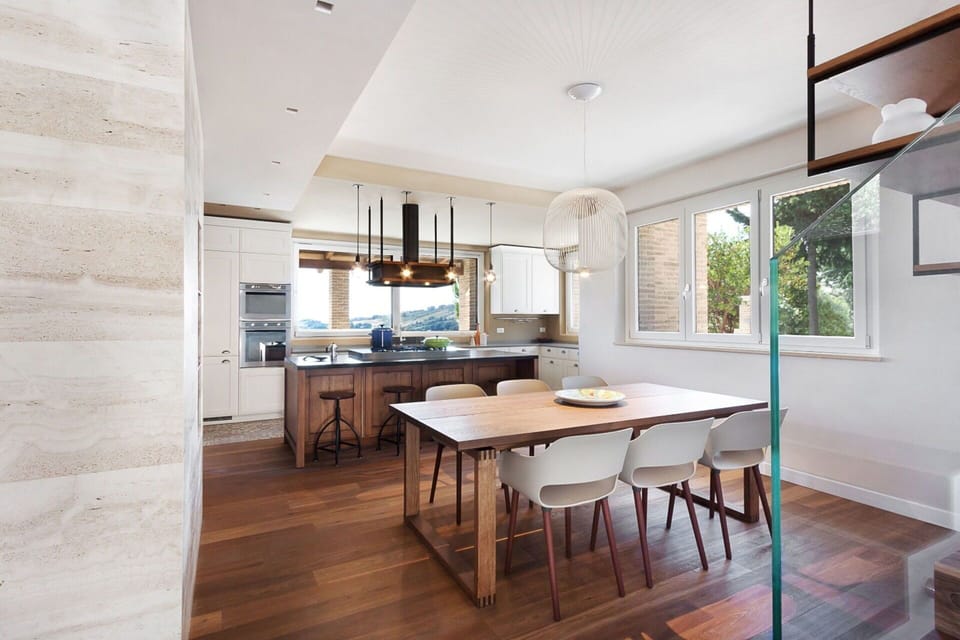 Furniture, Interior Design, Flooring, Floor, Wood Flooring, Wall, Wood, Ceiling, Light Fixture, Kitchen & Dining Room Table