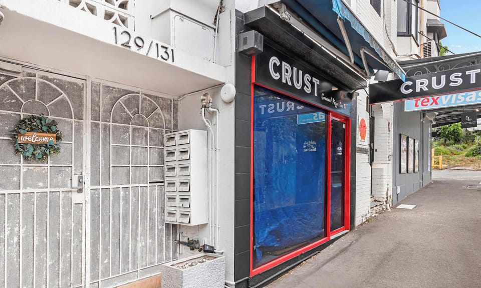 Conveniently located building entrance in a vibrant neighborhood setting.