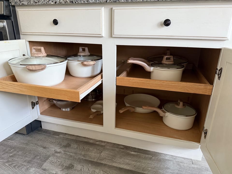 Fully stocked kitchen with cookware, dishes, and essentials