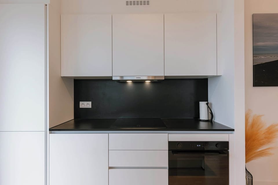 The fully equipped kitchen offers everything you need for a gourmet stay, including a state-of-the-art oven and induction cooktop.