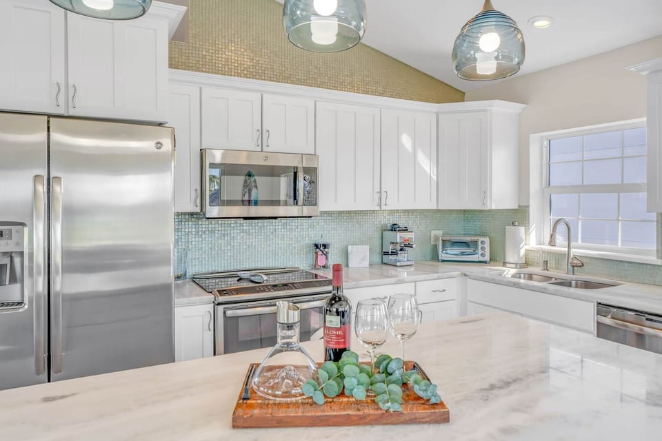 Second level kitchen with fridge microwave stove oven toaster oven