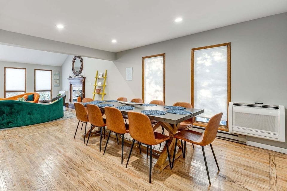 Gather around this spacious dining table for memorable meals and lively conversations with your loved ones. Enjoy the bright, inviting atmosphere perfect for sharing stories and laughter after a day of adventure.