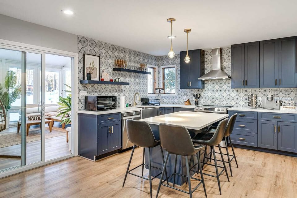 Whip up your favorite meals in this fully equipped, thoughtfully designed kitchen, then gather around the island for a delightful chat.