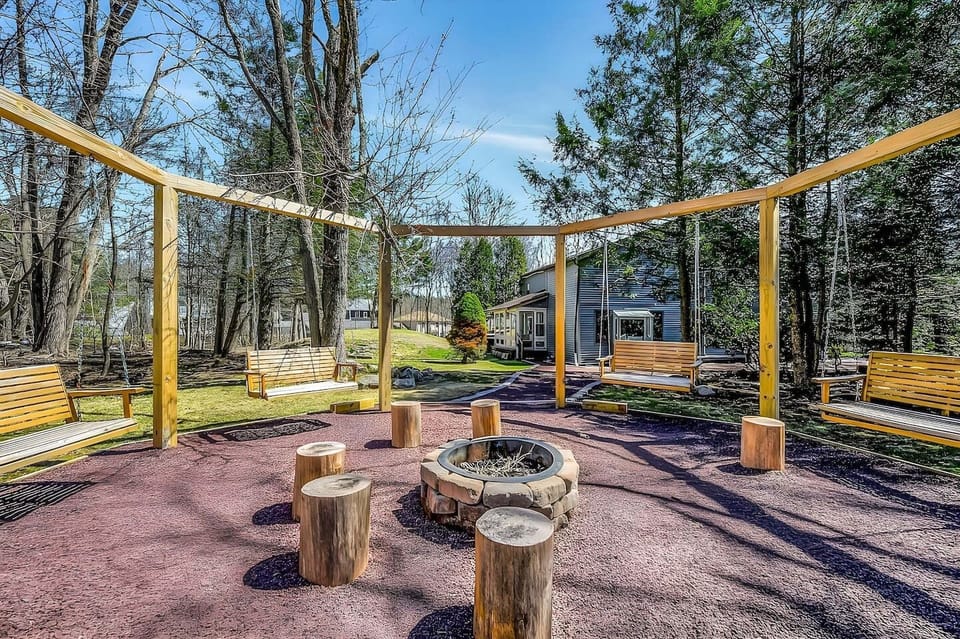 Gather around the cozy fire pit under the open sky, sharing stories and laughter with loved ones. Then, relax and sway gently on the inviting porch swings as evening descends.