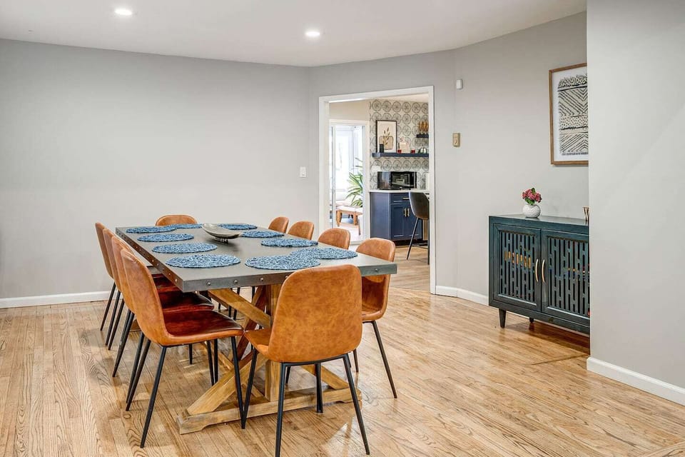 Gather with loved ones around this spacious dining table, perfect for sharing delicious meals and creating lasting memories.