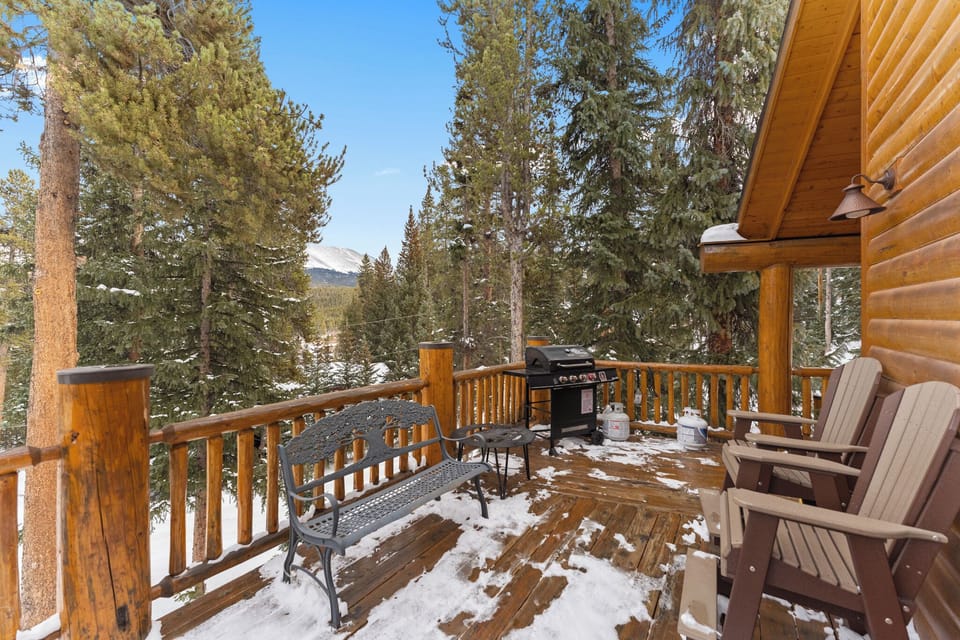 Step onto your private mountain deck where snowy peaks frame perfect mornings. Fire up the grill while soaking in alpine tranquility from cozy chairs.