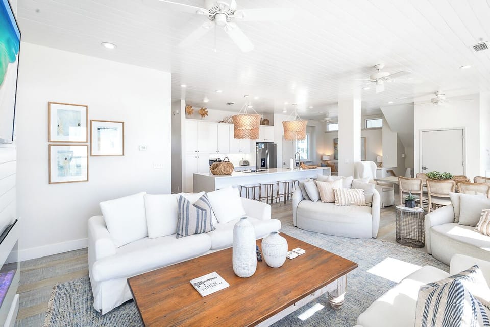 One of many generous living spaces, with amazing Gulf views and ample seating among thoughtful amenities that provide a refined, fun and welcoming home away from home..