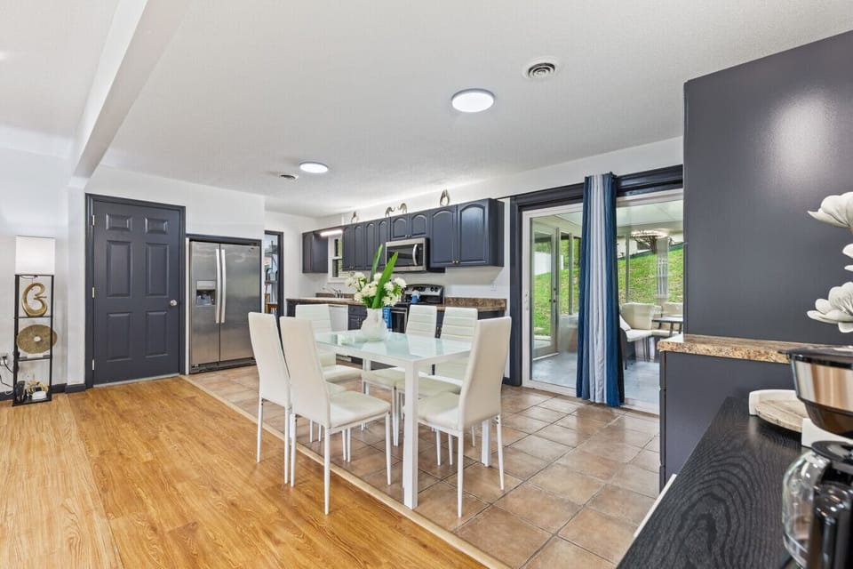 Sleek appliances and spacious counters make cooking a breeze. Whether you`re prepping for a feast or sharing a snack, this space flows easily into the dining area.