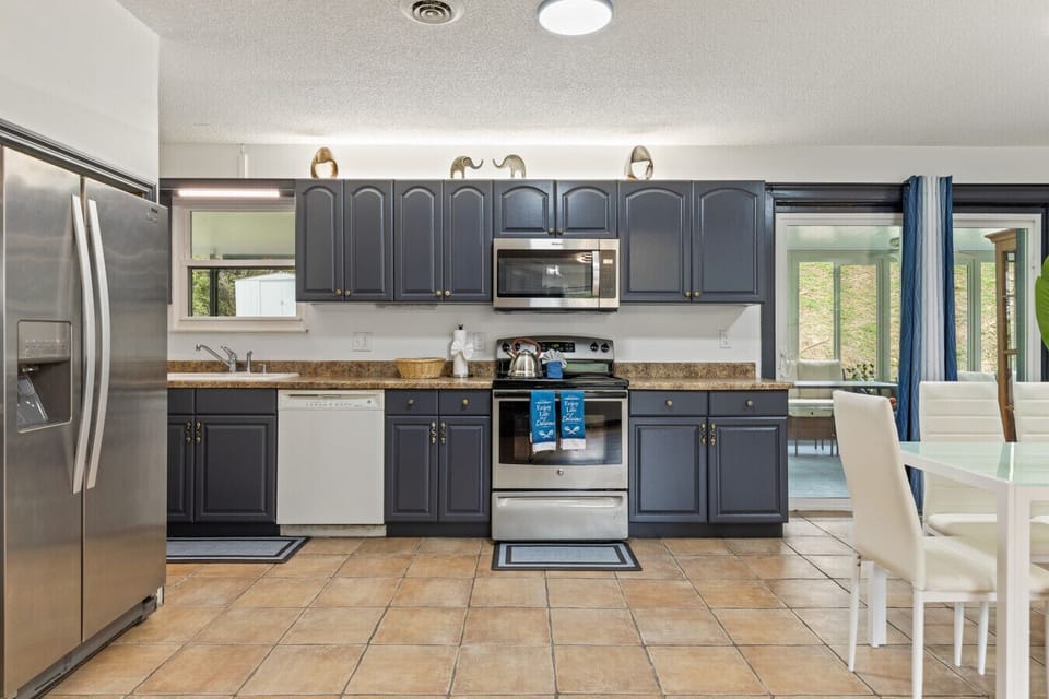 From fresh breakfasts to late-night snacks, this fully equipped kitchen opens up to the dining area and sunroom, making it easy to stay connected.