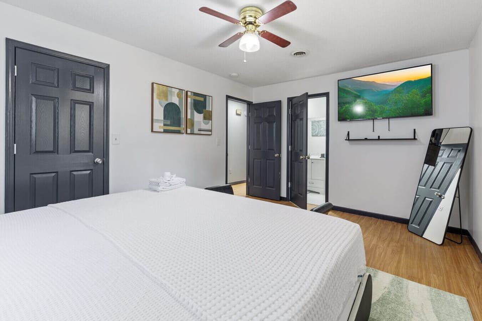 With direct access to the bathroom and a large smart TV, this king bedroom blends comfort and convenience. Lounge on the bed and soak in the simple, calming vibe.