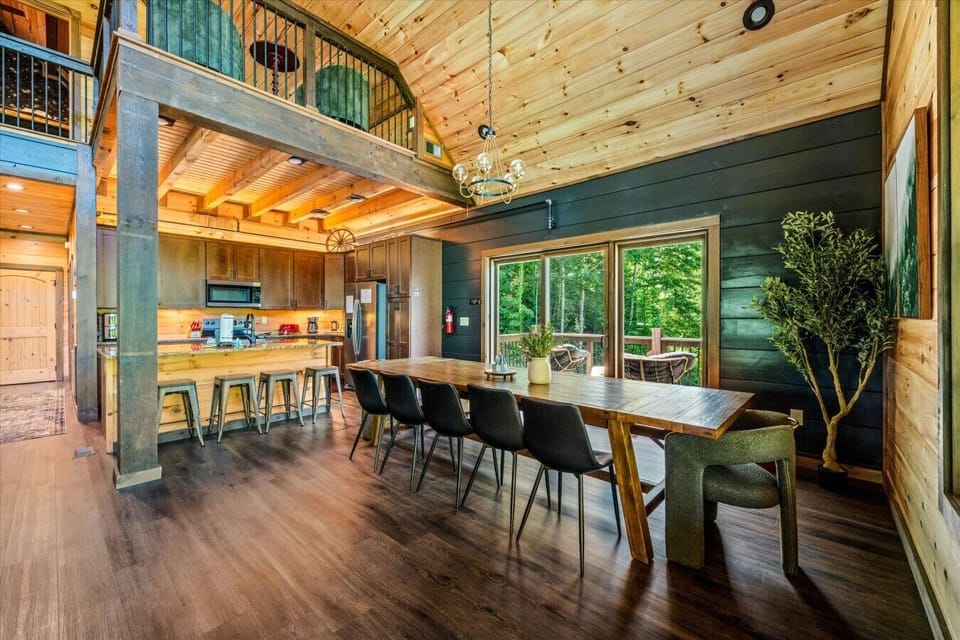 Enjoy meals together with seating for the whole group just steps from the fully equipped kitchen. Large windows and easy access to the deck make every gathering feel special.