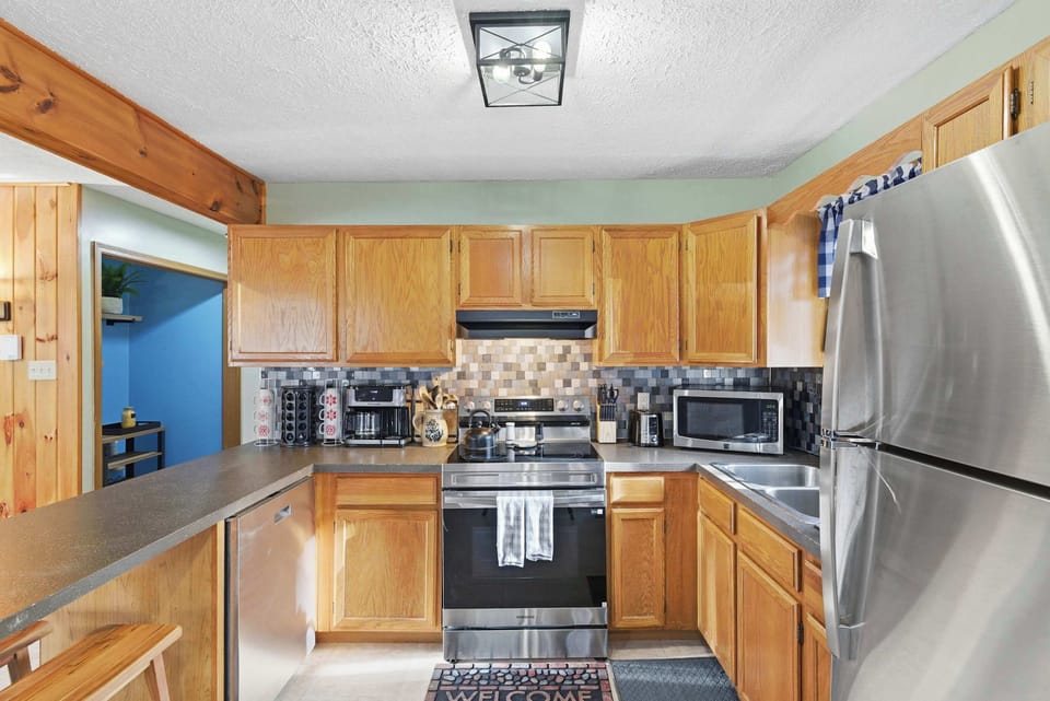 Modern kitchen with ample counter space and essentials.