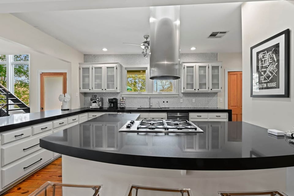 Chef's Kitchen with Gas Stovetop, Double Ovens, Microwave, Ice Maker  and Full Refrigerator
