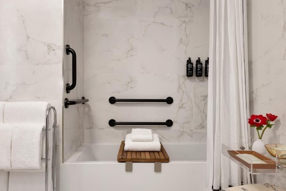Soak and relax in a marble bath with luxe amenities.