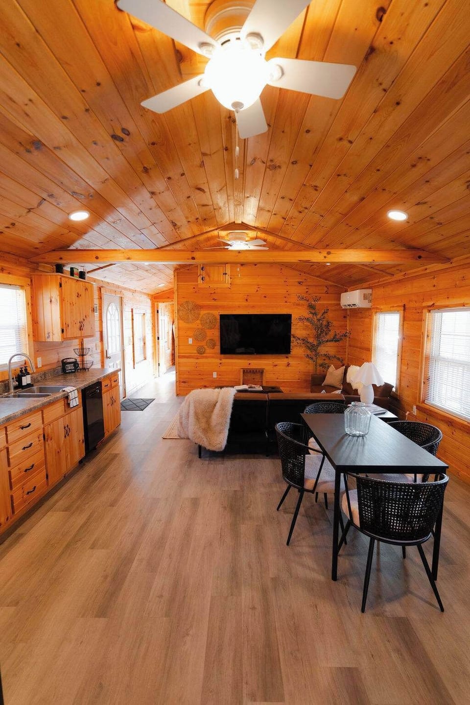 Living Area: Inviting space with wood accents, modern furnishings, and a perfect spot for relaxation!