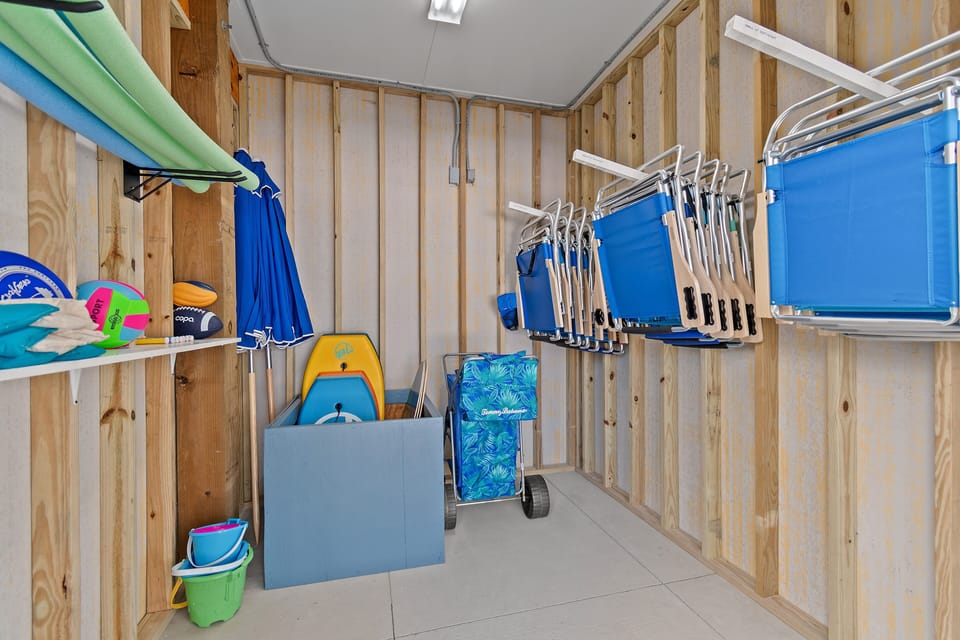 Renter's closet including beach chairs, umbrellas, beach boards/toys and cart. 