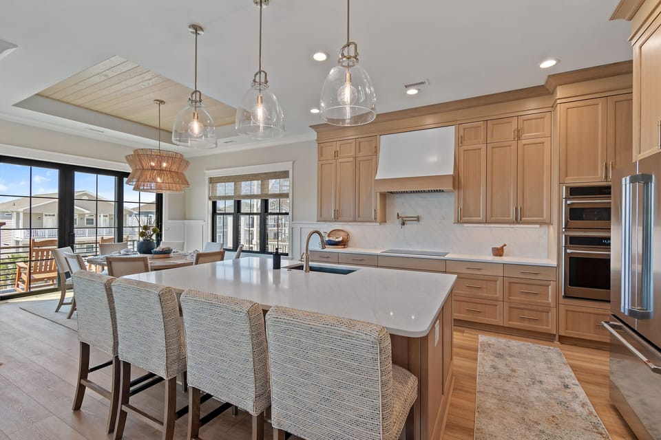Large island in fully stocked gourmet style kitchen.  Seating for four. 